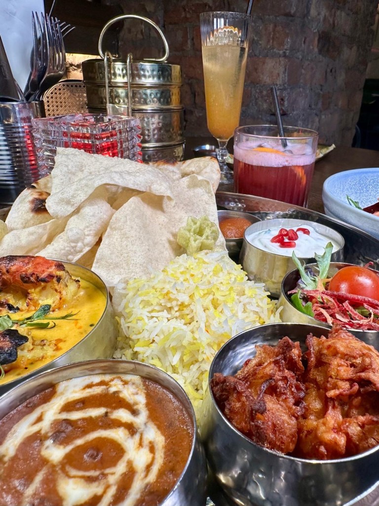 A vibrant spread of Dakwala’s Canteen Special Prawn Thali Platter, Bombay Chilli Cheese Toast, and Fresh Mango & Beetroot Salad.