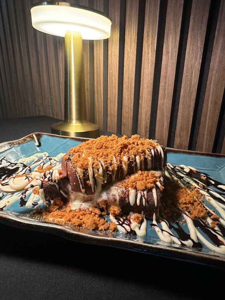 A decadent Belgian chocolate brownie topped with a Magnum ice cream bar at Chester’s Lounge.