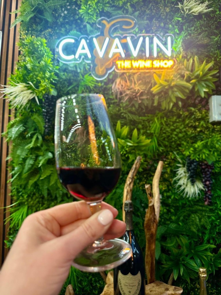 A close-up of a glass of red wine at Newcastle Cavavin, highlighting its rich color and smooth texture.
