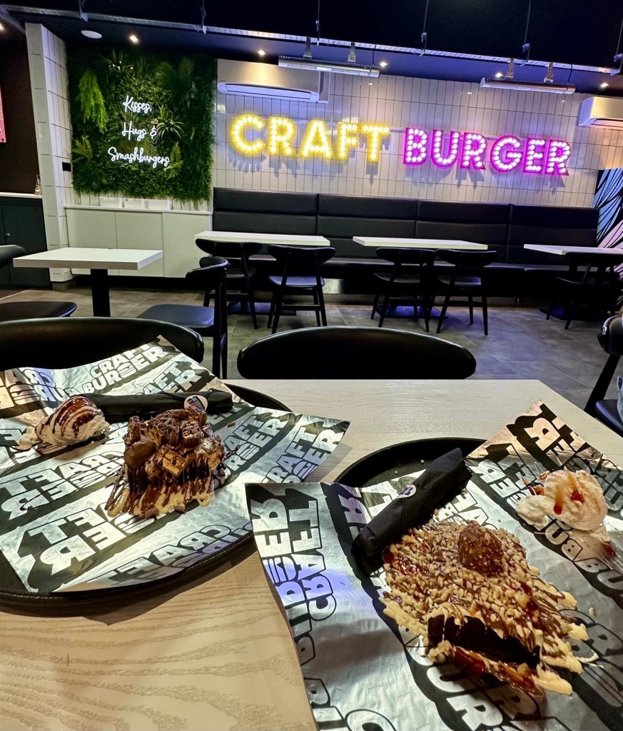 Assortment of decadent desserts including Ferrero Rocher and Snickers brownies, signature stack pancakes, and American Dream waffle at Craft Burger South Shields.