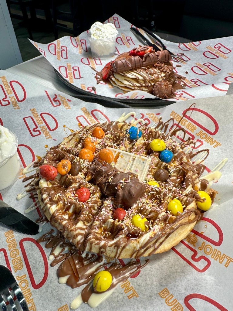 Craft Burger’s American Dream waffle and Ferrero Kinder pancakes loaded with chocolate and toppings.