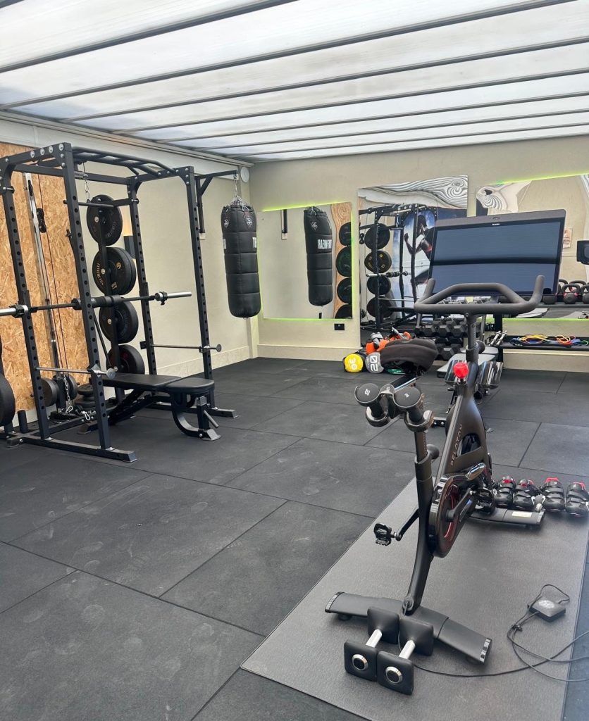 Compact on-site gym with cardio and strength equipment at High Hill Stay.