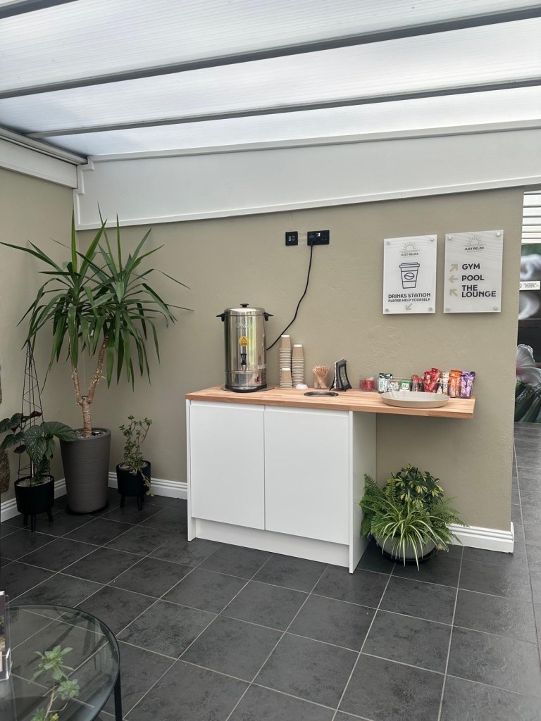 Self-serve drink station with tea, coffee, and refreshments at High Hill Stay spa.