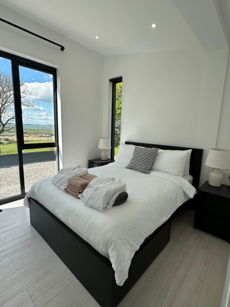Cosy and stylish bedroom in The Valley lodge at High Hill Stay.