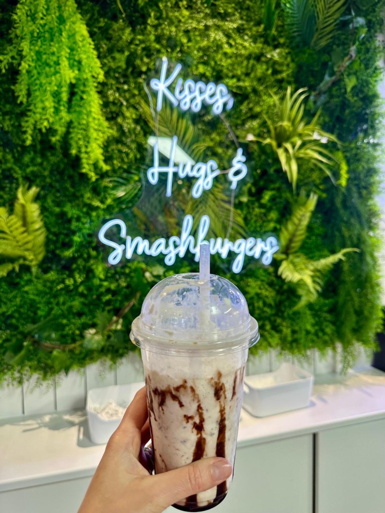 Creamy Snickers milkshake topped with whipped cream and chocolate drizzle at Craft Burger South Shields.