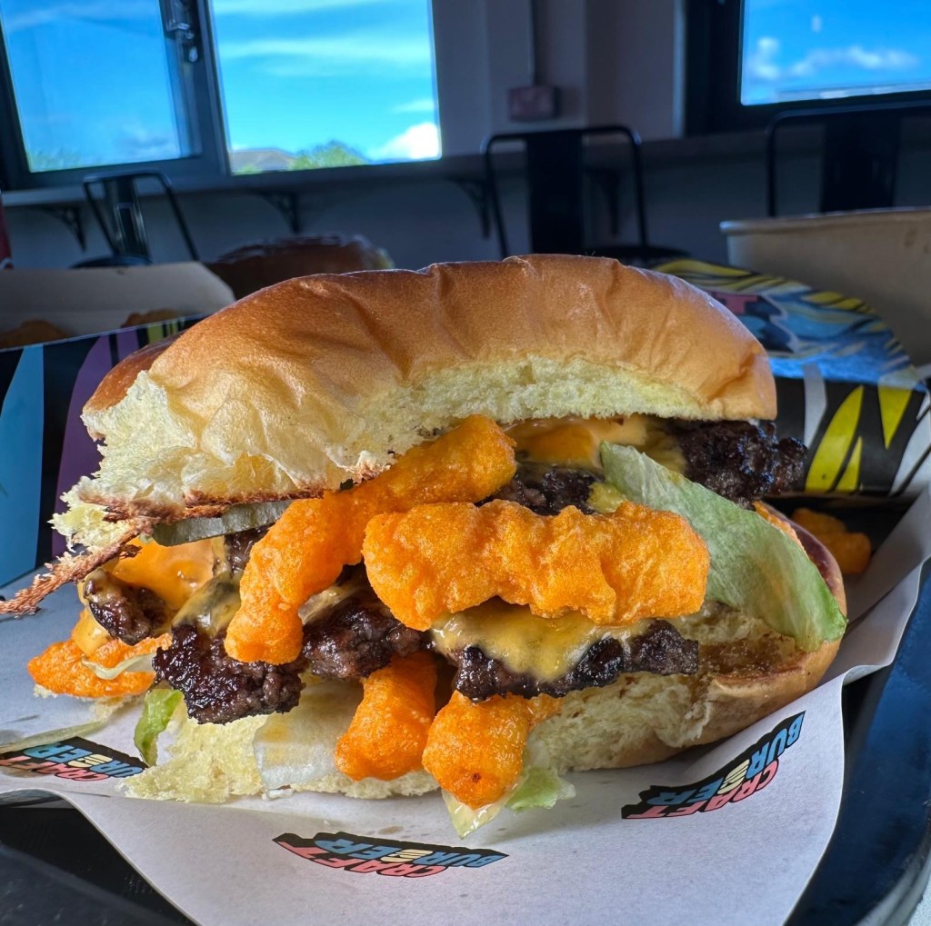 Cheetos Smash Burger from Craft Burger Gosforth topped with crispy American Cheetos and extra gherkins.