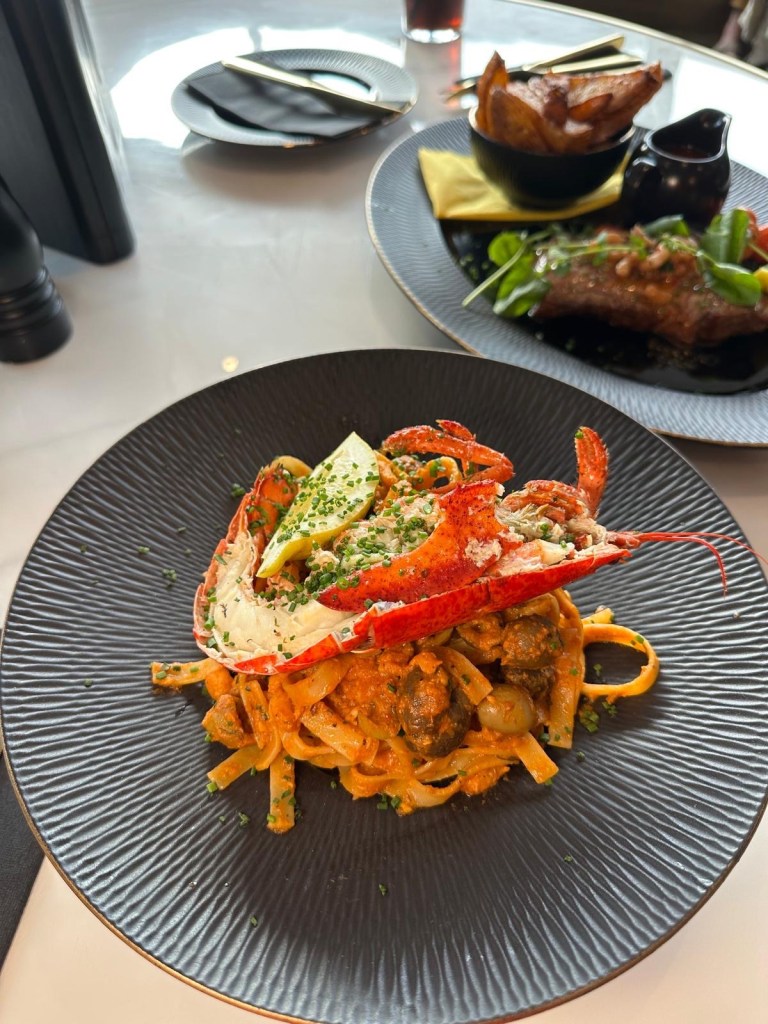 Lobster pasta at Wyvestow’s South Shields with prawns, anchovies, olives, and Bloody Mary sauce, topped with half a lobster
