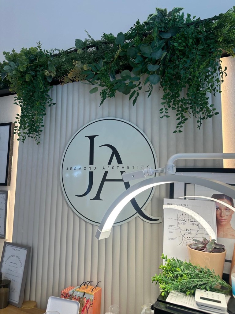 Jesmond Aesthetics clinic wall logo with elegant, minimalist design