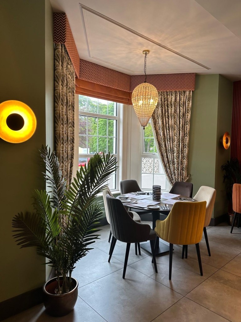 Chakh Dhoom restaurant interior with Indian art and vibrant decor