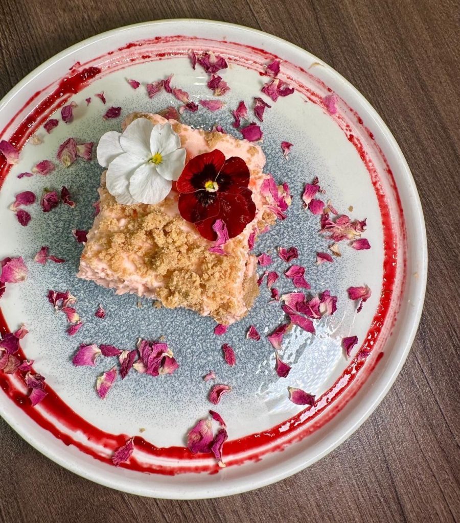 Rose and cardamom cheesecake topped with petals at Chakh Dhoom