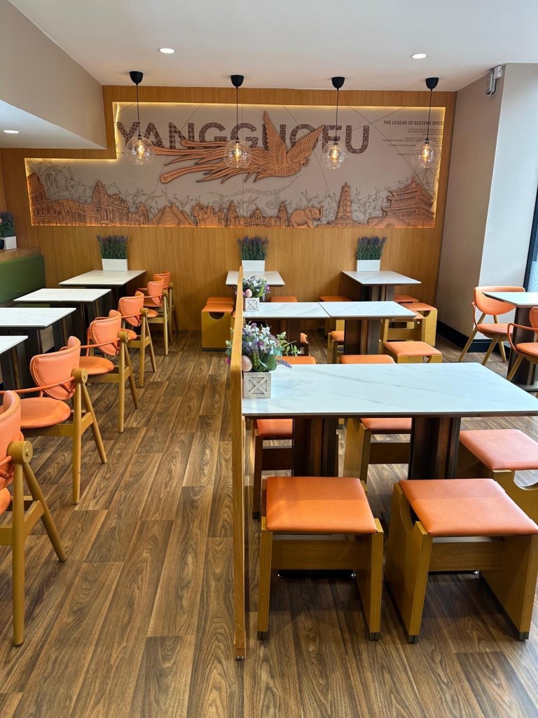 Interior seating at Yangguofu Malatang Newcastle with modern, casual design