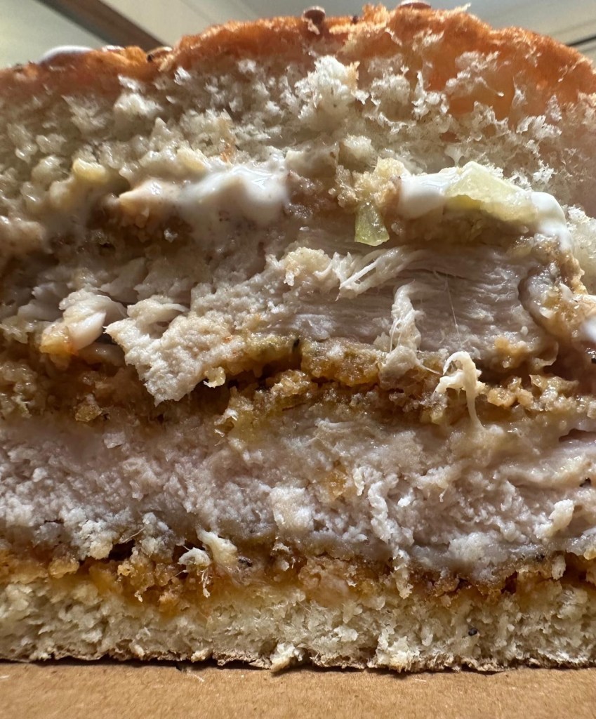 Crispy peri peri chicken burger stacked high with Cajun fries at Caspian Kebab Birtley.