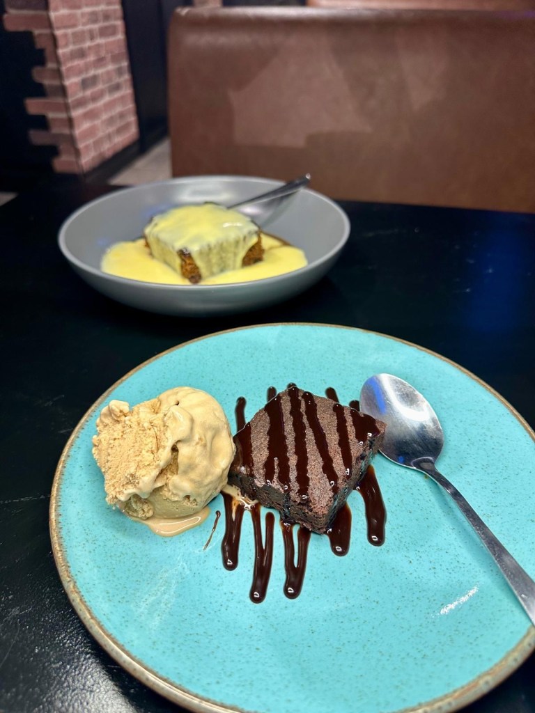 Chocolate brownie and sticky toffee pudding desserts at Abajo Newcastle