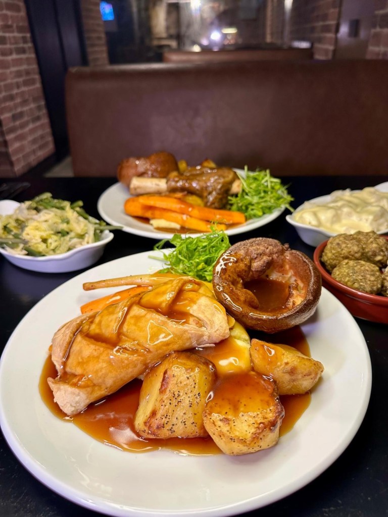 Vegetarian Sunday roast with vegetables, roast potatoes and Yorkshire pudding at Abajo Newcastle