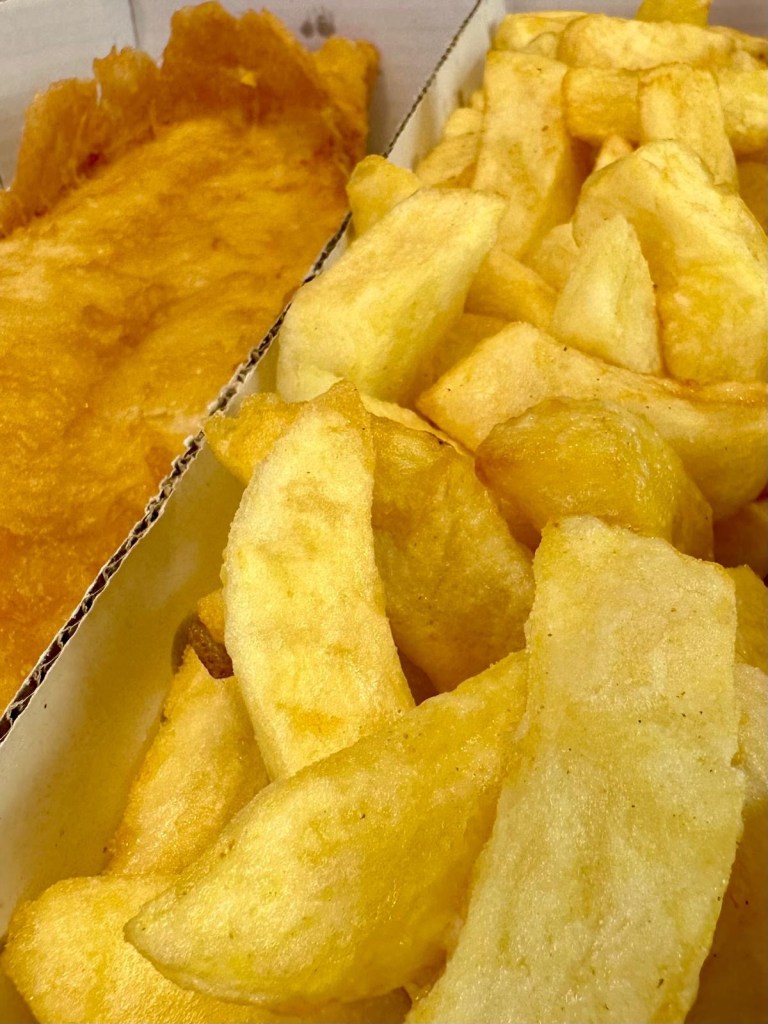 Close-up of crispy battered cod and golden chips from Krispies Fish & Chips in Forest Hall