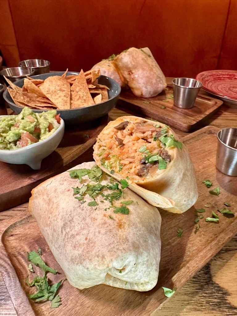 Fresh mushroom burrito with avocado salsa and coriander at Motel Mexicana Newcastle
