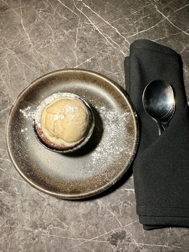 Chocolate soufflé with vanilla ice cream at 3Sixty Newcastle