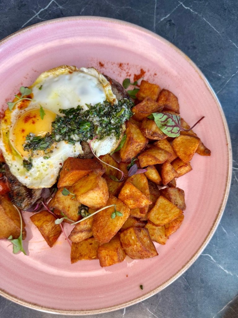 Steak and eggs with chimichurri and roast potatoes at 3Sixty Newcastle