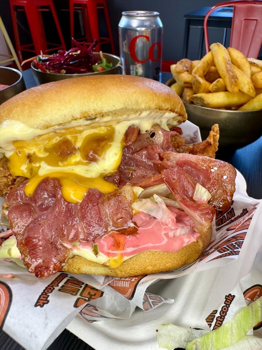 Double buttermilk chicken Club Supreme burger with cheese, beef bacon and Buffalo sauce at Mangal Newcastle