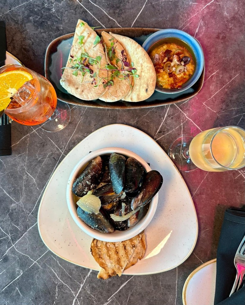 Mussels in white wine broth and hummus with pita bread at 3Sixty Newcastle