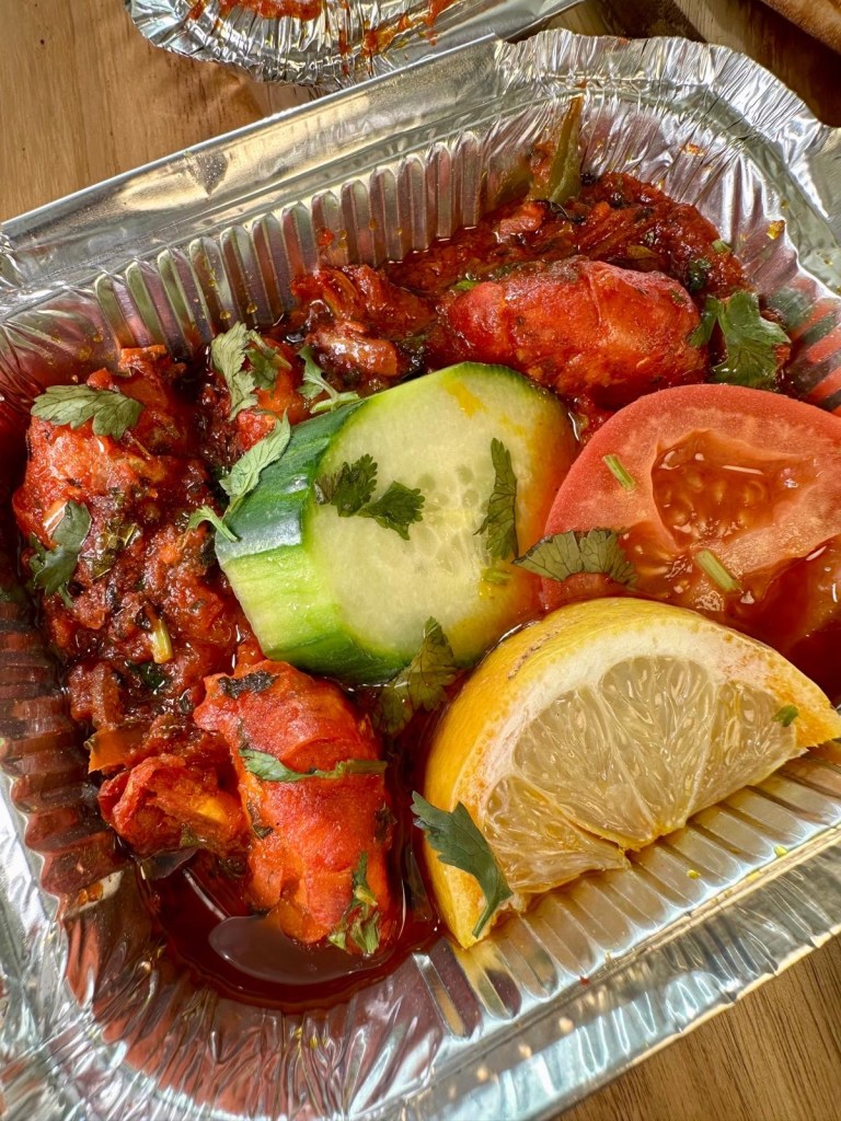 Spiced king prawns served on a soft puri from Nisha’s Tandoori in Gateshead