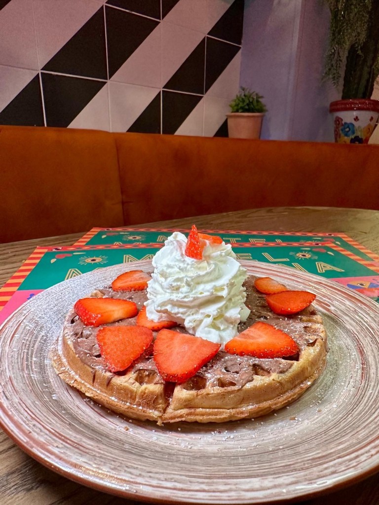 Strawberry waffle dessert with ice cream at Motel Mexicana Newcastle
