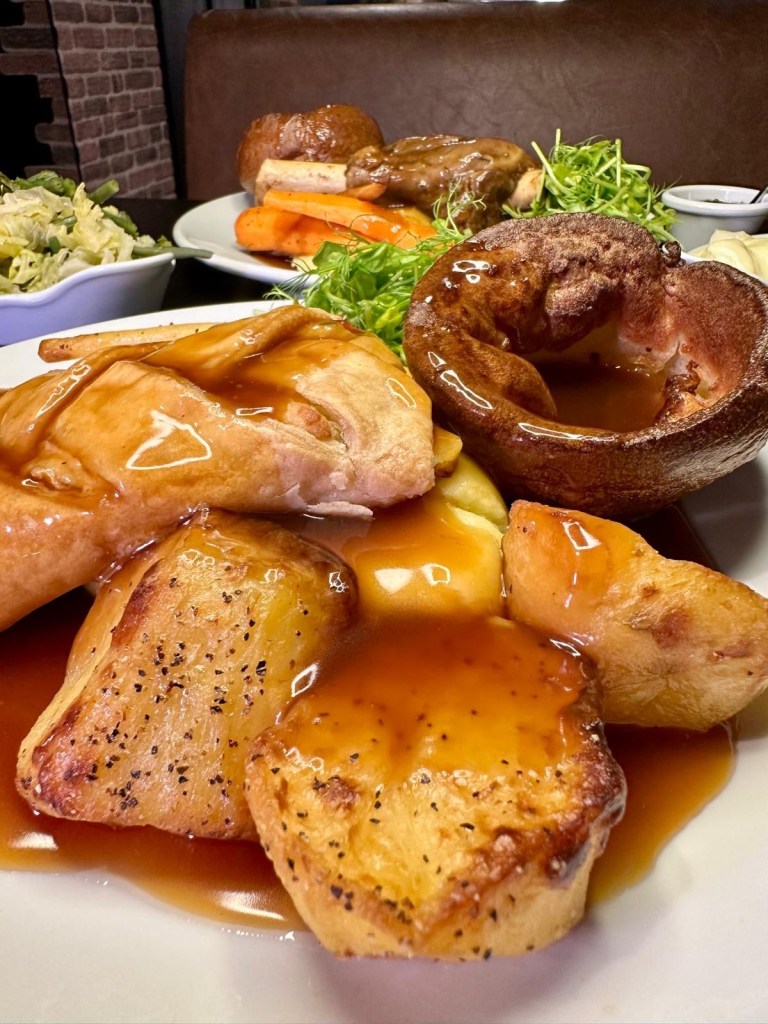 Vegetarian Sunday roast with vegetables, roast potatoes and Yorkshire pudding at Abajo Newcastle