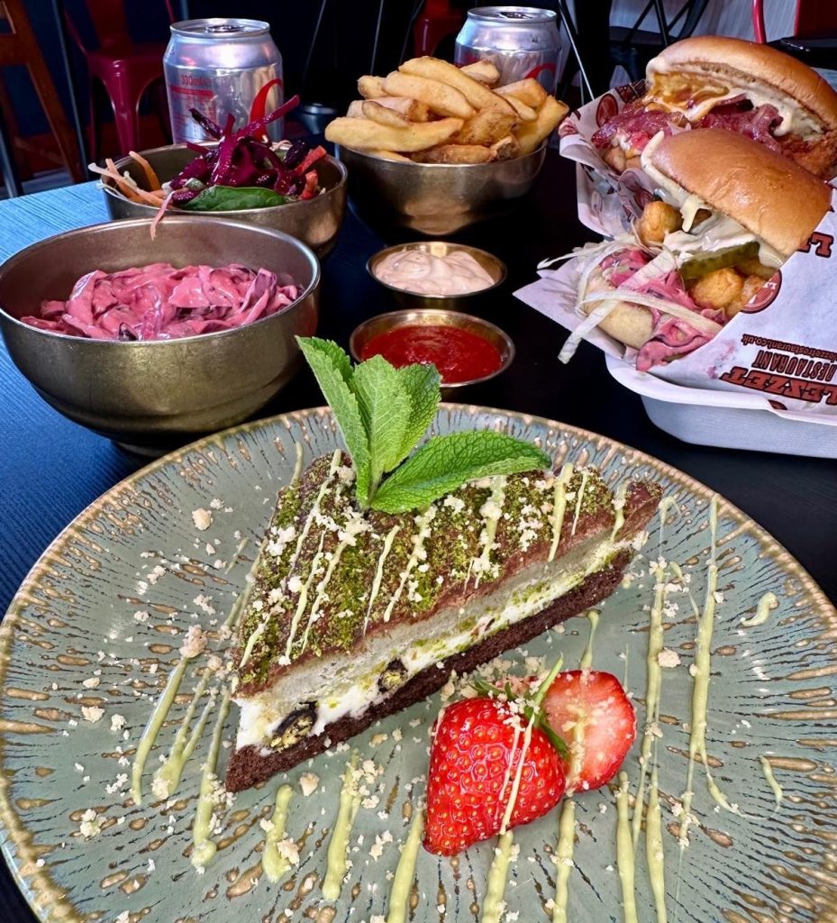 Layered pistachio cake dessert served at Mangal Newcastle