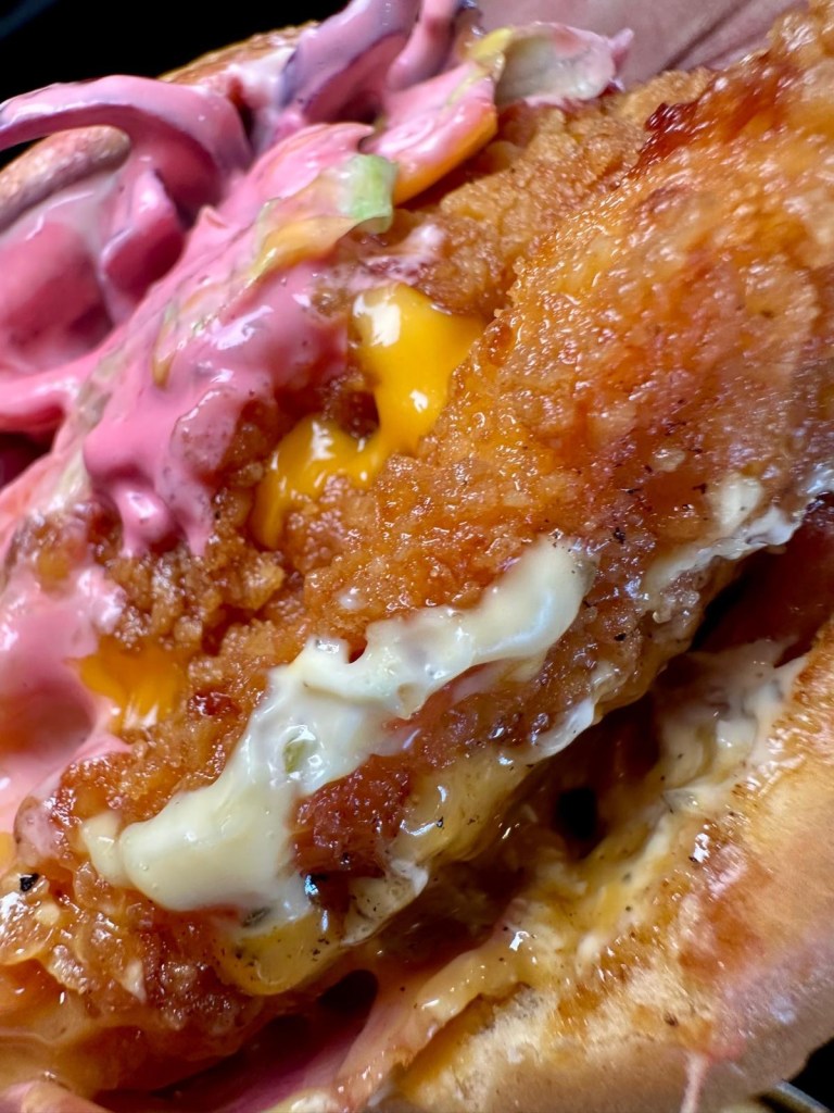 Double buttermilk chicken Club Supreme burger with cheese, beef bacon and Buffalo sauce at Mangal Newcastle