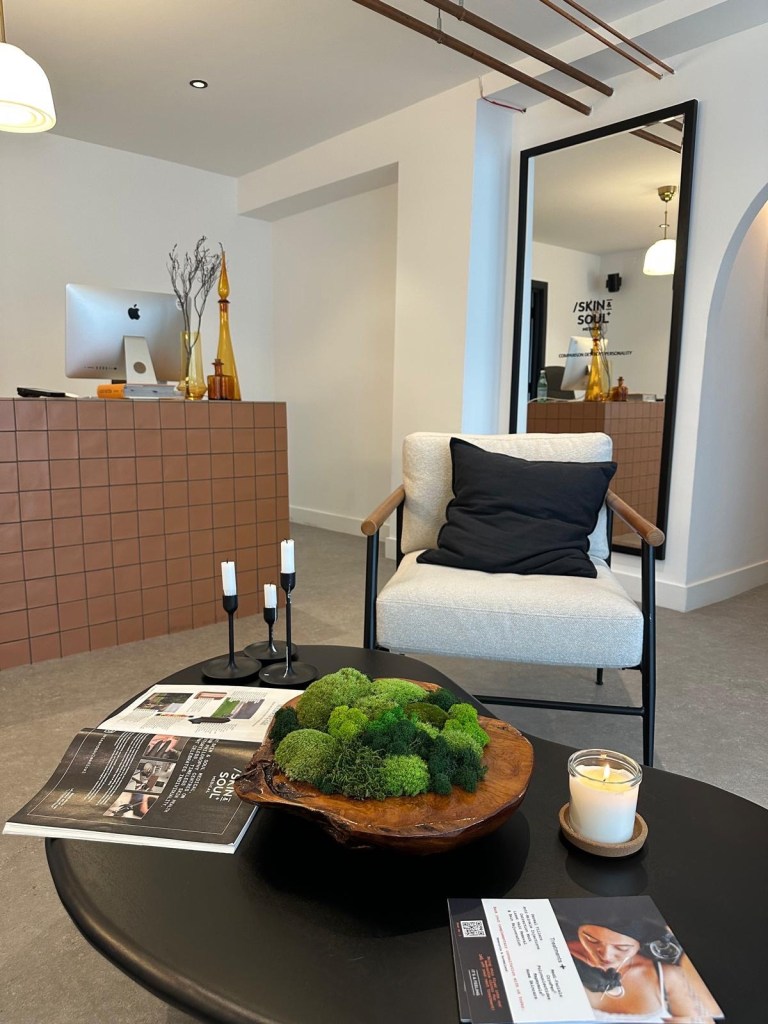 Skin & Soul Medical Newcastle reception area with modern minimalist decor, soft lighting, and welcoming atmosphere