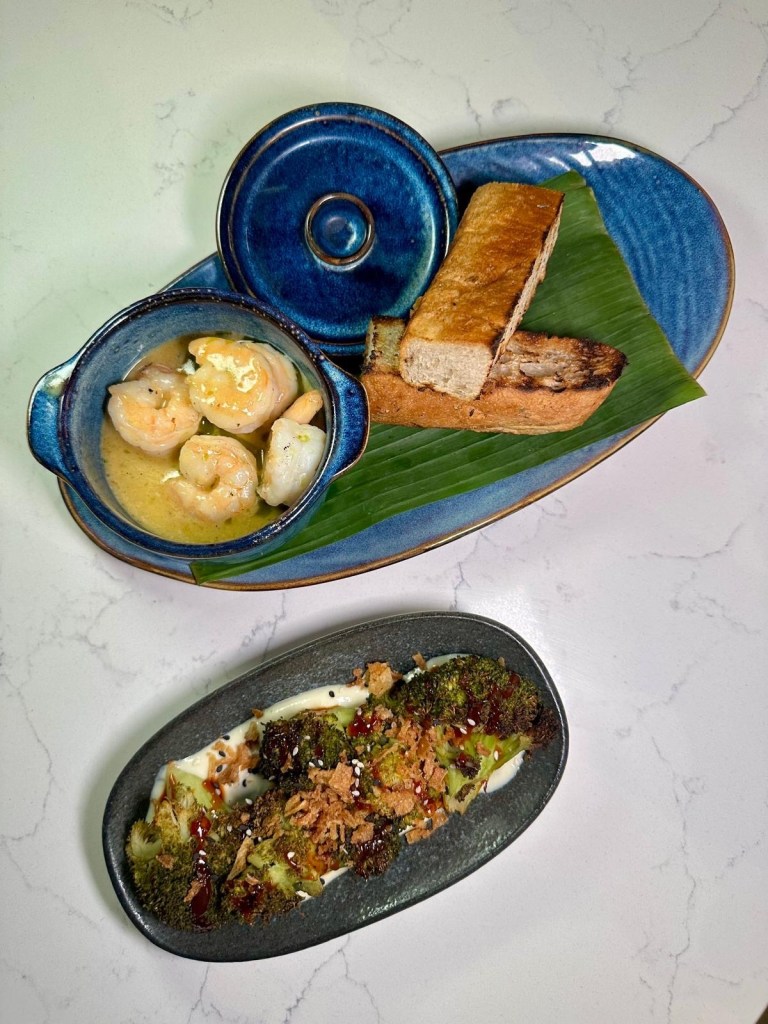 Moku Newcastle starters including miso garlic prawns with bread and barbecued Korean broccoli