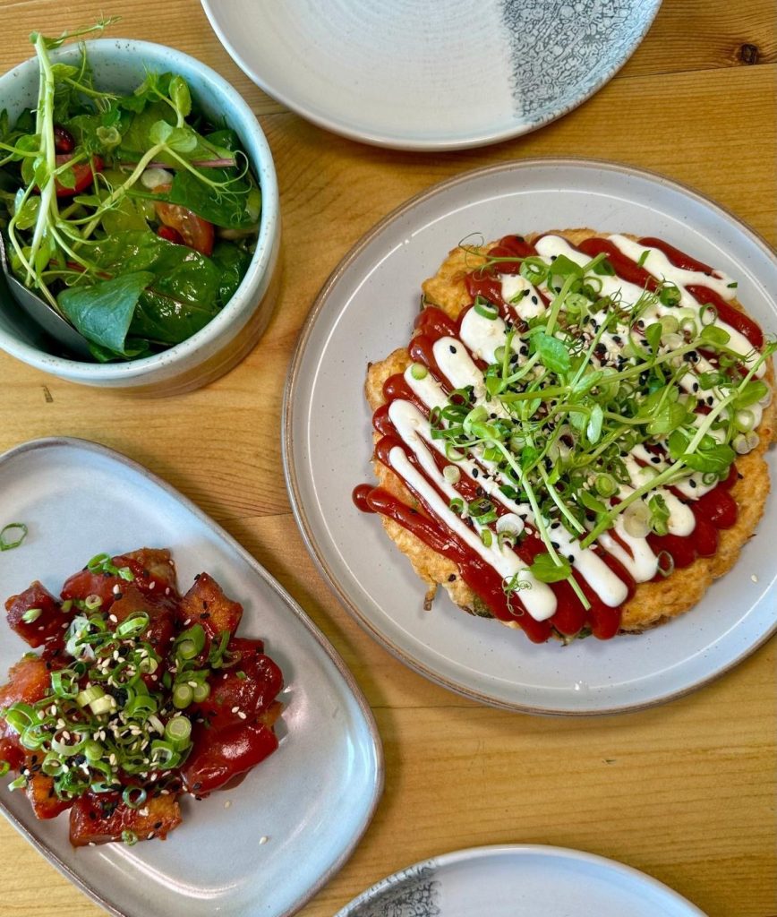 Japanese vegetable pancake, Korean pork belly with sesame and spring onions, and a fresh house salad at Isla in Durham.