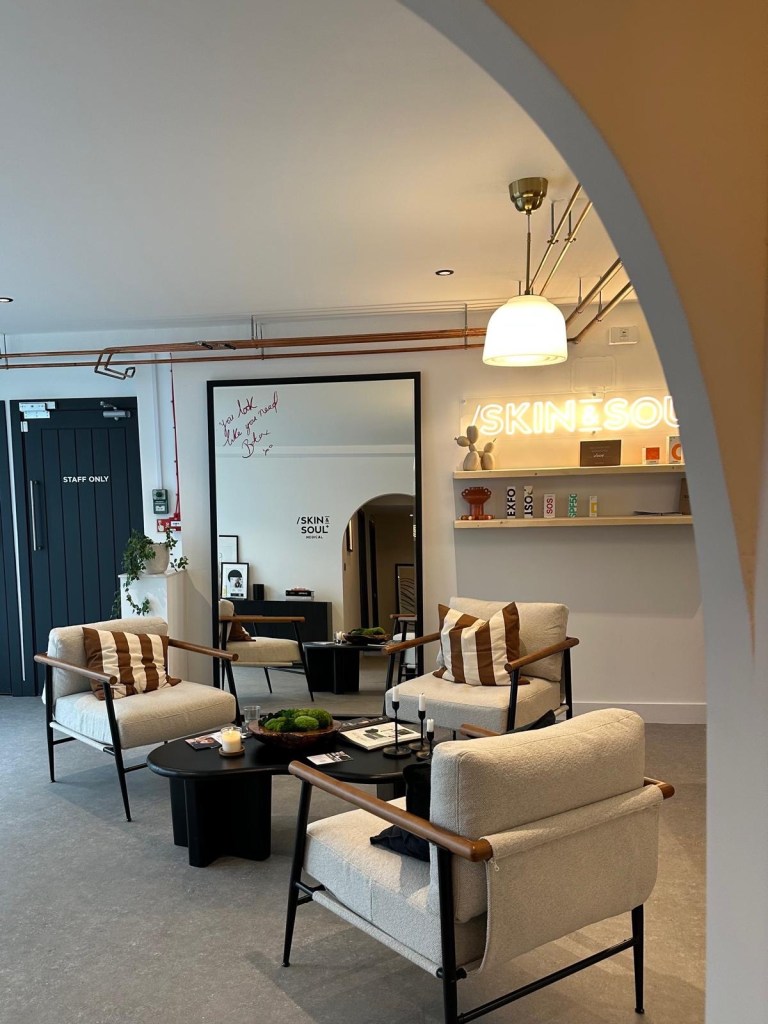 Skin & Soul Medical Newcastle reception area with modern minimalist decor, soft lighting, and welcoming atmosphere