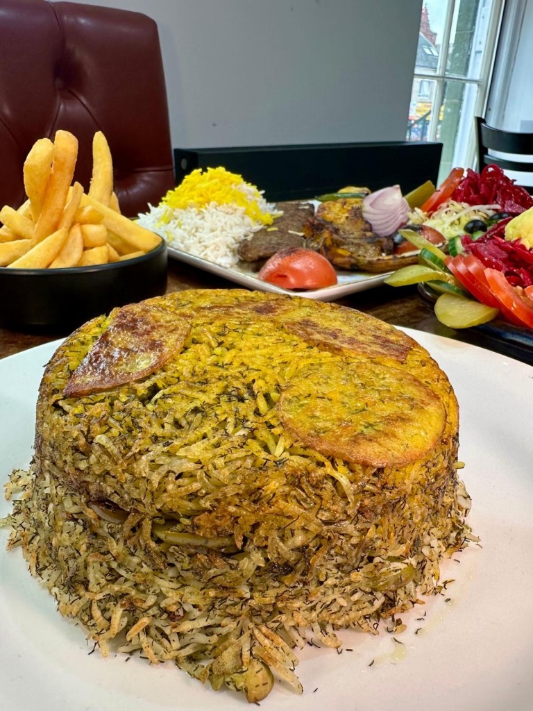 Fluffy saffron rice served with grilled Persian dishes at Rose Restaurant Newcastle
