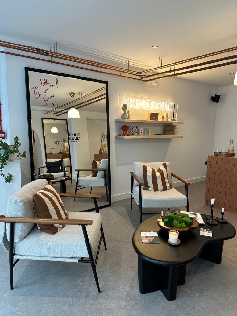 Skin & Soul Medical Newcastle reception area with modern minimalist decor, soft lighting, and welcoming atmosphere