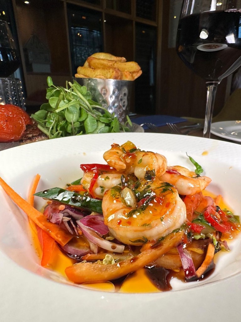 Close-up of grilled prawns with herbs and lemon served at Jozef’s Restaurant in Radisson Blu Durham