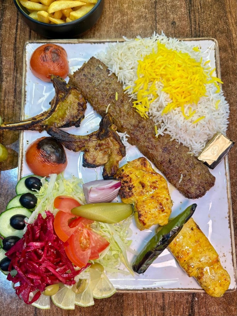 Persian mixed grill with lamb chops, chicken fillet, minced lamb, naan and rice at Rose Restaurant