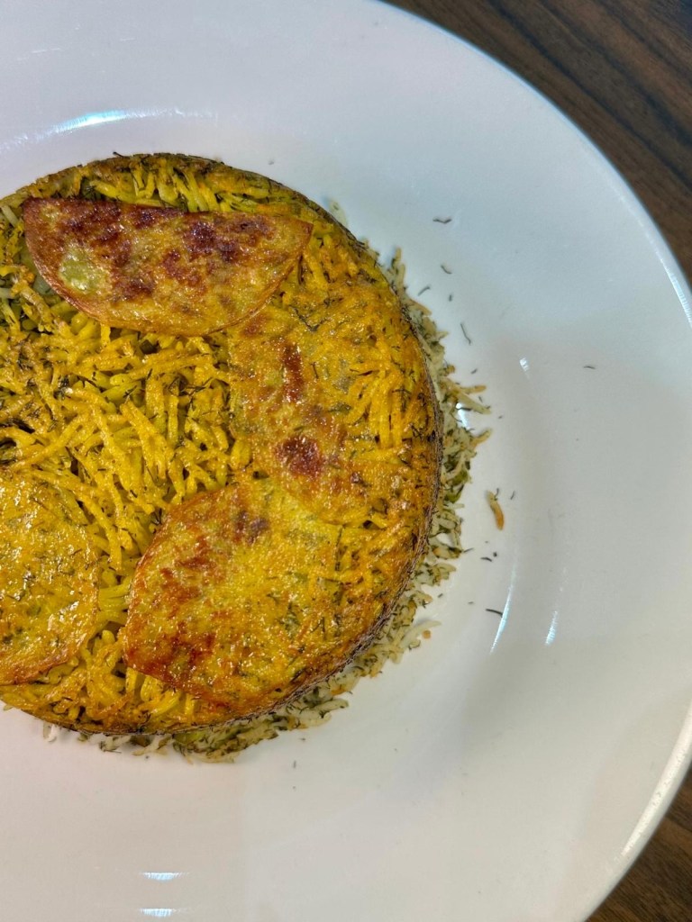 Fluffy saffron rice served with grilled Persian dishes at Rose Restaurant Newcastle