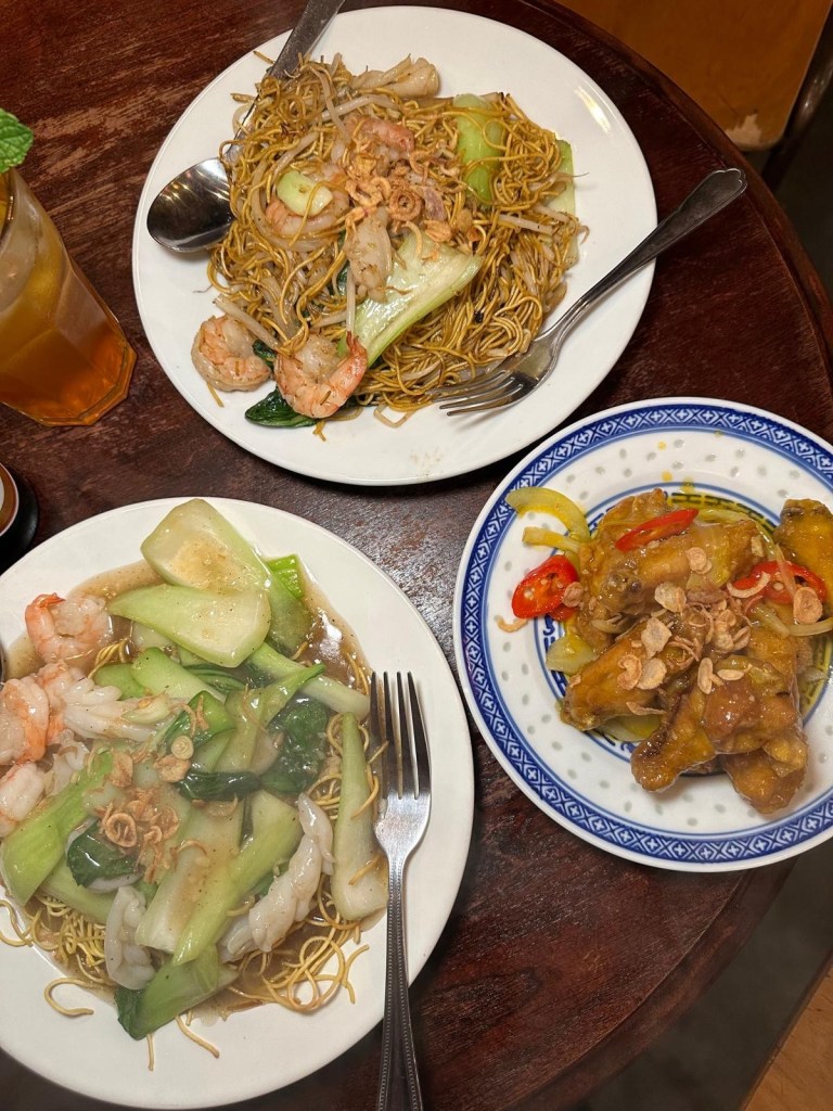 A spread of Vietnamese dishes at Ngon Café Newcastle including vermicelli noodle bowls, grilled king prawns, and sticky fish sauce wings.