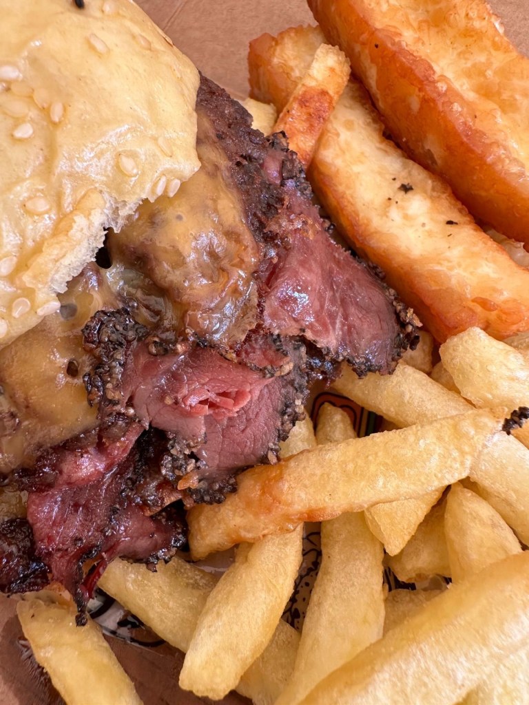 Gourmet burgers from Friez&Burgz Newcastle, including the peppercorn special and the pastrami-topped original.