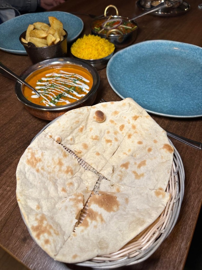 Garlic naan bread at Babaji Sunderland, freshly baked in the tandoor.