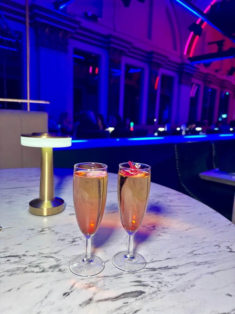 Purple Peacock Newcastle stage dancers performing on stage in vibrant costumes