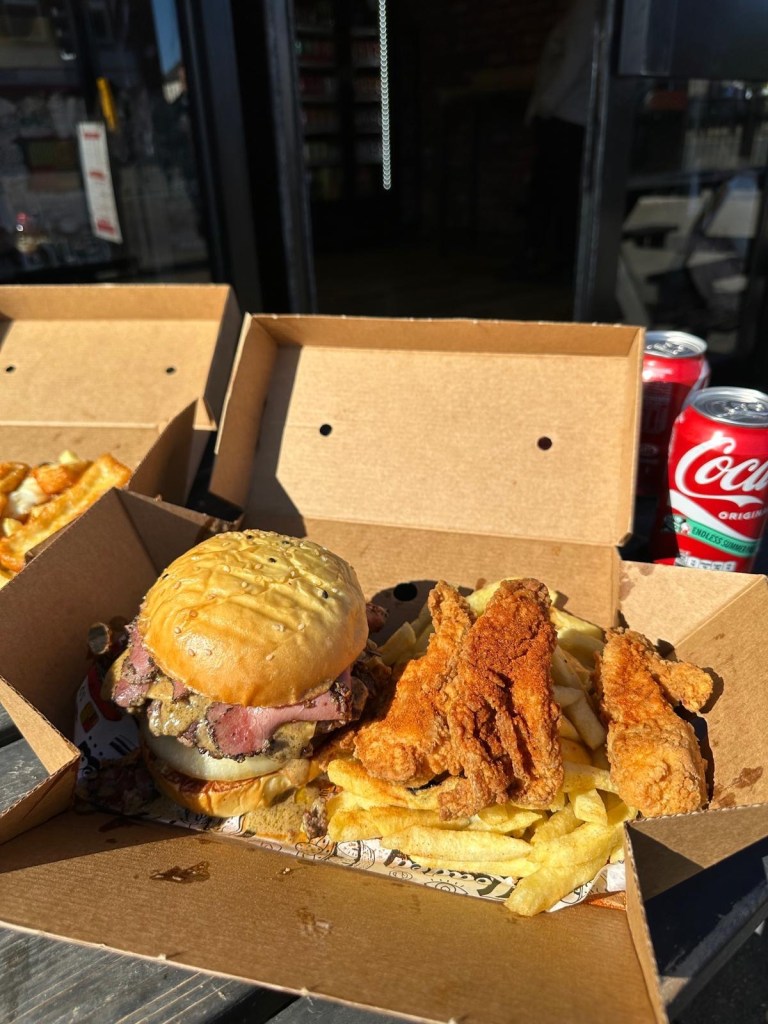 Peppercorn burger with spicy chicken filets and fries from Friez&Burgz Newcastle.