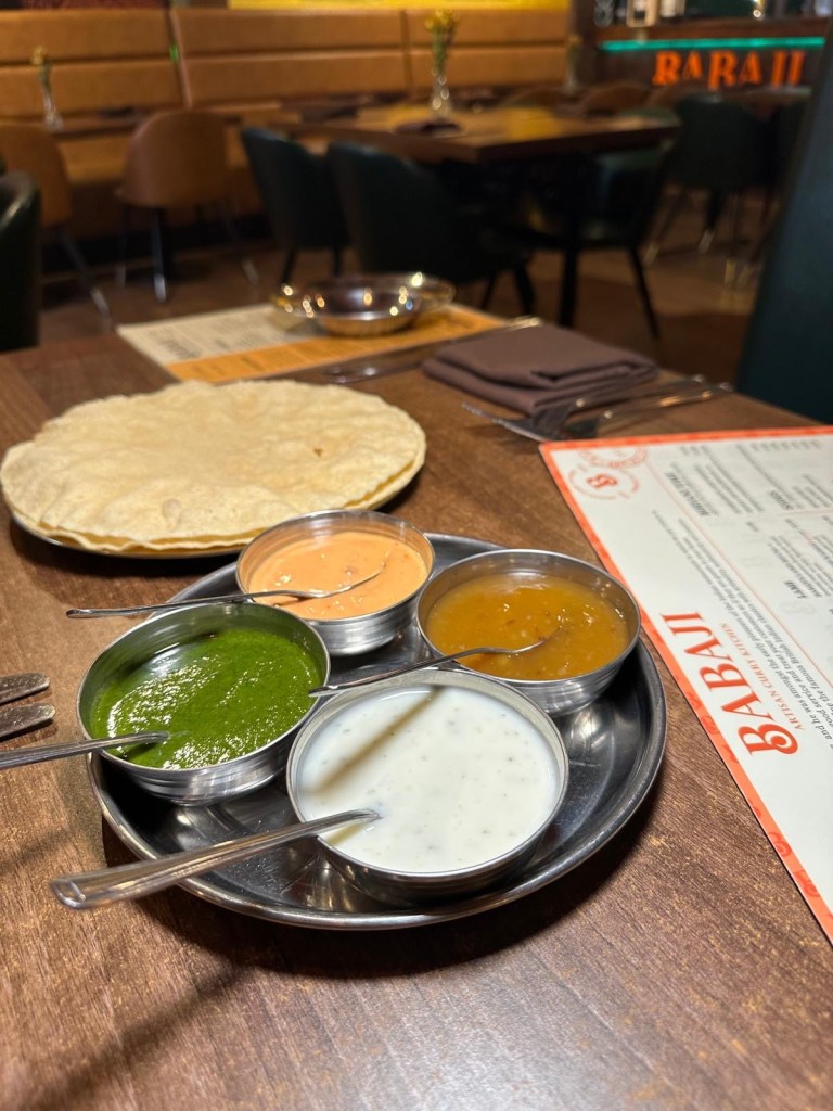 Crispy poppadoms served with chutneys and coriander dip at Babaji Sunderland.