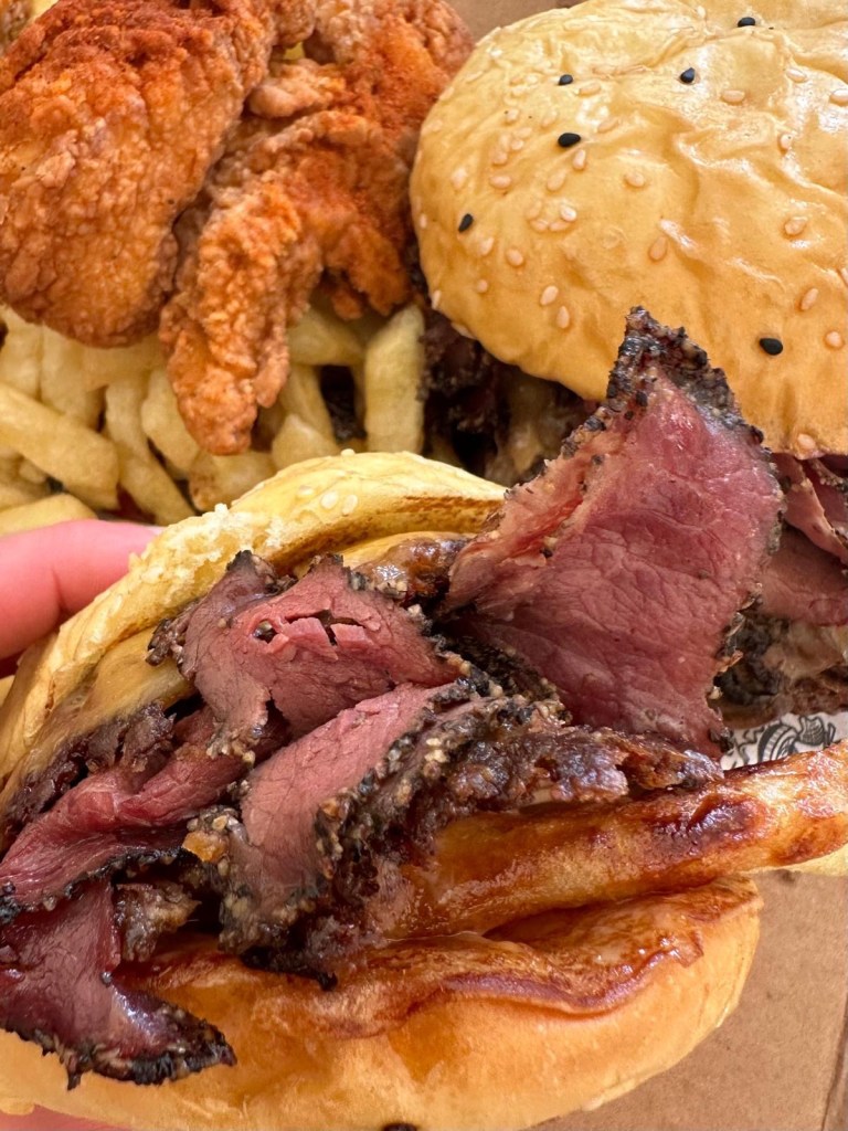 Gourmet burgers from Friez&Burgz Newcastle, including the peppercorn special and the pastrami-topped original.