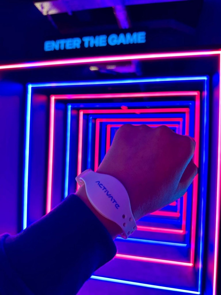 Activate Metrocentre entrance glowing with neon lights and gaming zones in Gateshead