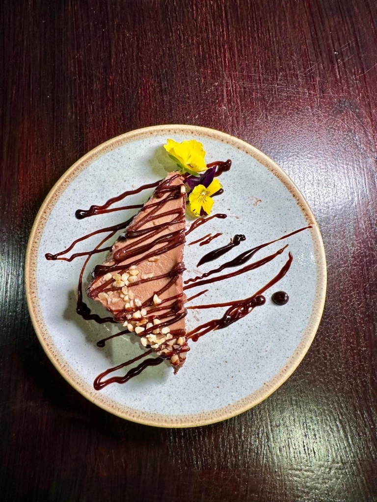 Nutella cheesecake at Olive Kitchen Newcastle with creamy filling and chocolate topping.