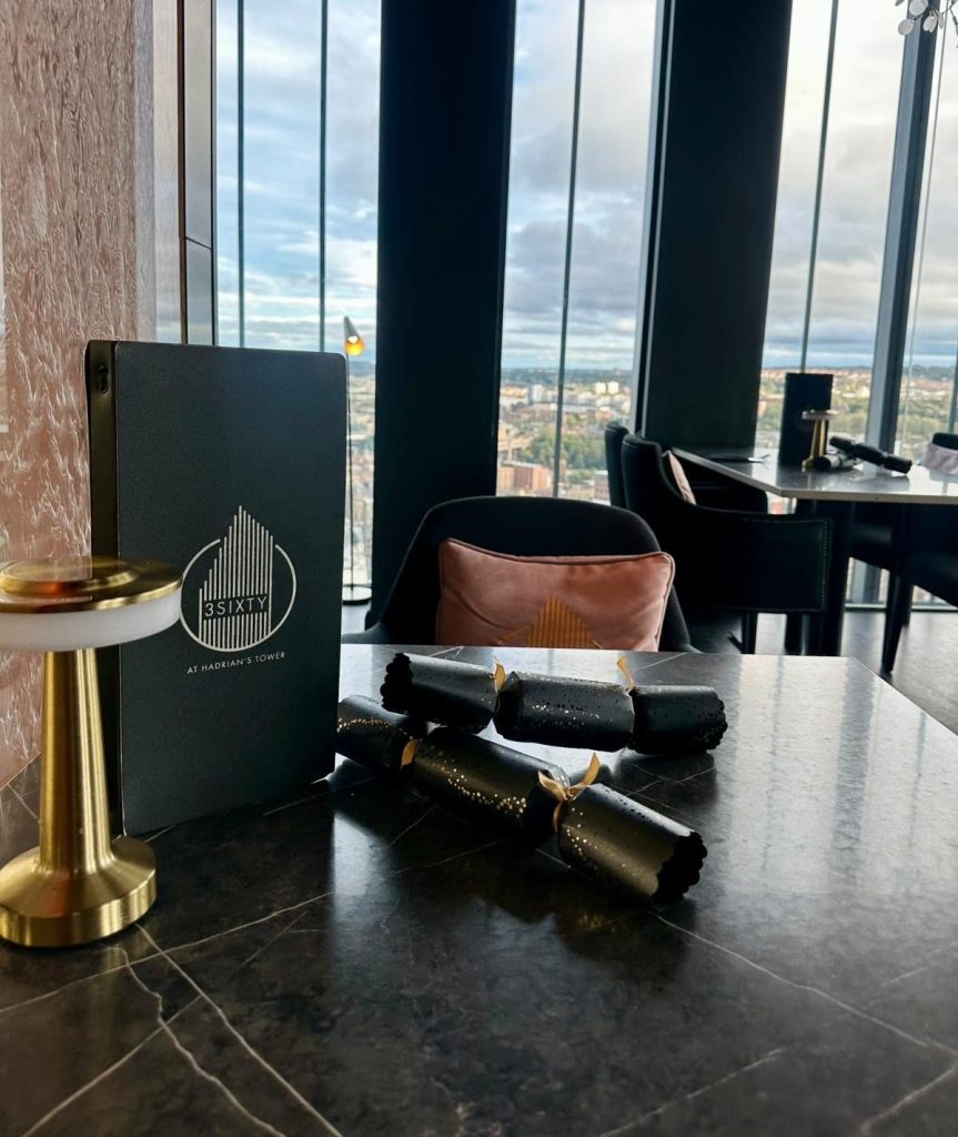 Interior of 3Sixty Newcastle restaurant decorated for festive dining.