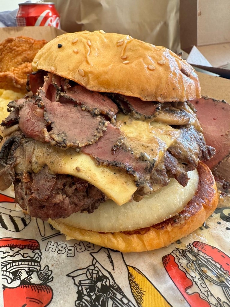 Gourmet burgers from Friez&Burgz Newcastle, including the peppercorn special and the pastrami-topped original.