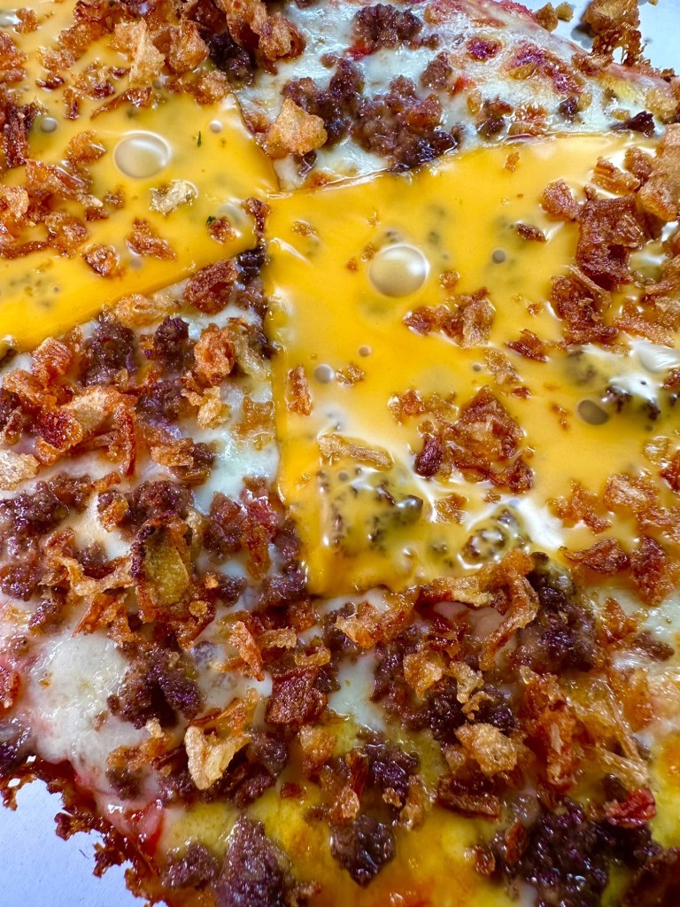 Slab Shop Mac Daddy Detroit pizza topped with ground beef, melted American cheese and crispy onions.